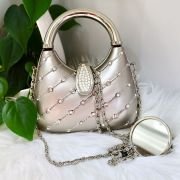 Small lady purse brushed silver in color carry with chain or without